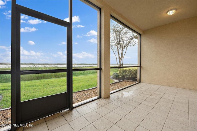 unfurnished sunroom featuring a healthy amount of sunlight