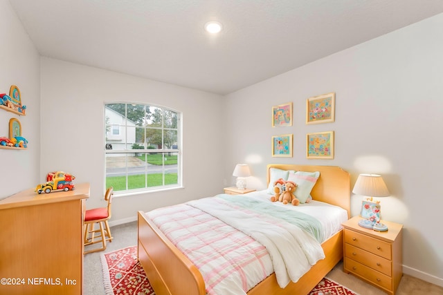 bedroom with light colored carpet