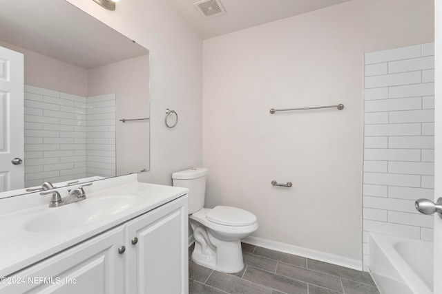 full bathroom featuring tiled shower / bath combo, vanity, and toilet