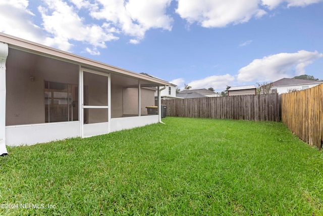 view of yard featuring a sunroom