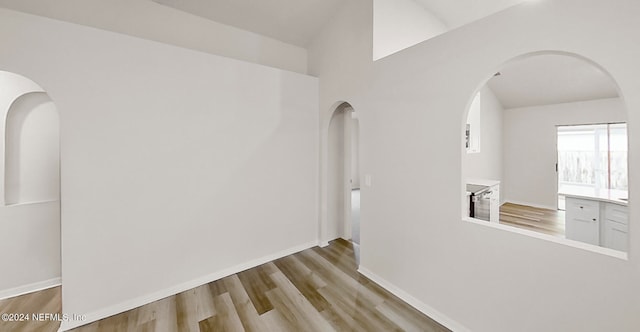 corridor featuring light hardwood / wood-style floors