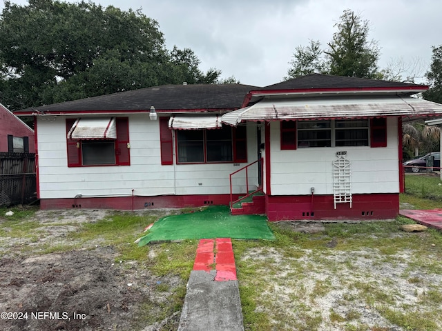 bungalow with a front lawn