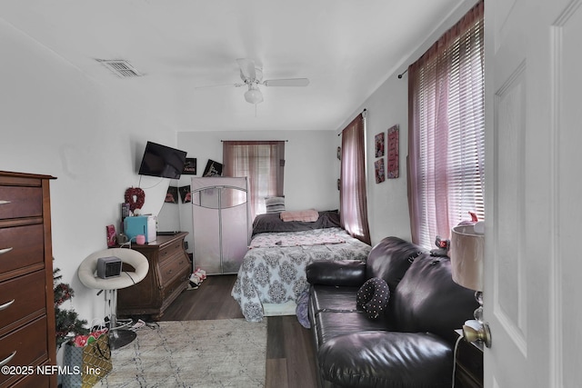 bedroom featuring ceiling fan and hardwood / wood-style flooring