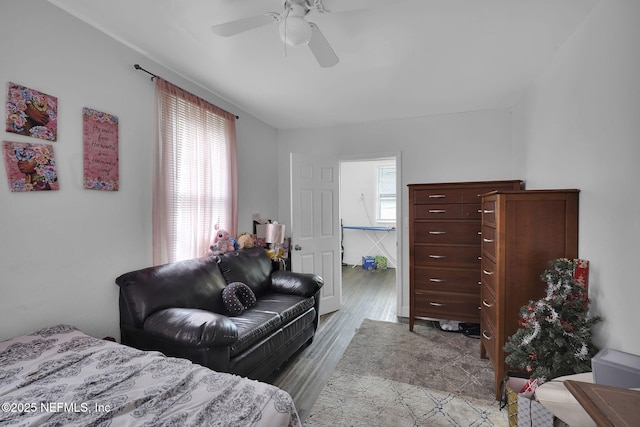 bedroom with ceiling fan and light hardwood / wood-style flooring