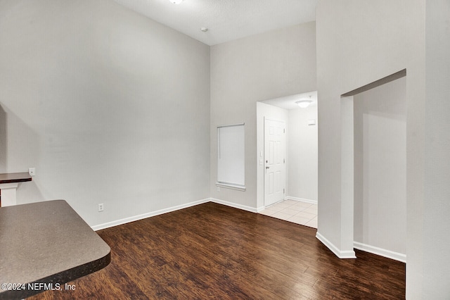 interior space featuring a textured ceiling and hardwood / wood-style flooring