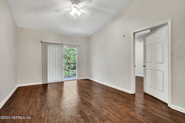 spare room featuring ceiling fan and dark hardwood / wood-style floors