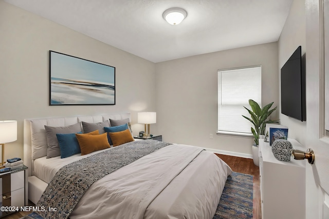 bedroom featuring dark hardwood / wood-style floors