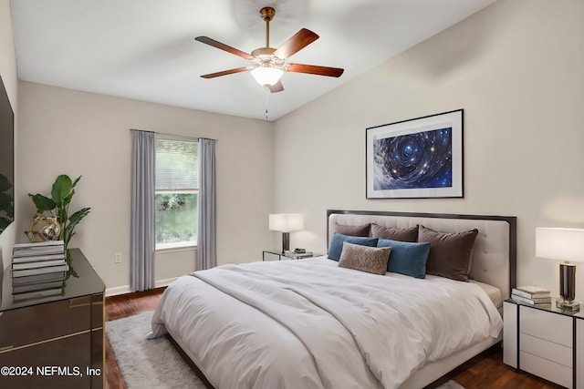 bedroom featuring ceiling fan, vaulted ceiling, and dark hardwood / wood-style flooring