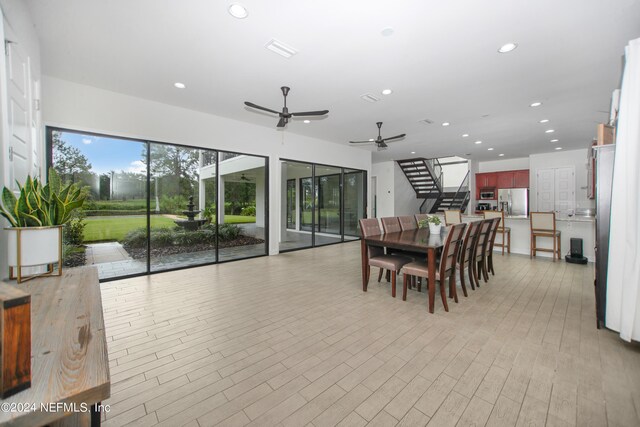 dining room featuring ceiling fan and light hardwood / wood-style flooring