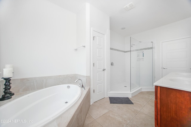 bathroom featuring vanity, separate shower and tub, and tile patterned floors