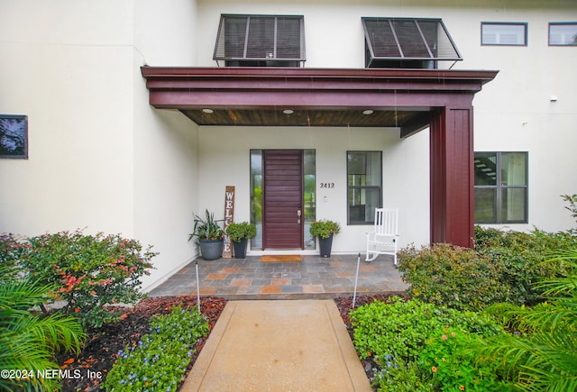 entrance to property with a porch