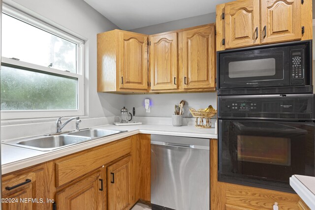 kitchen with black appliances and sink