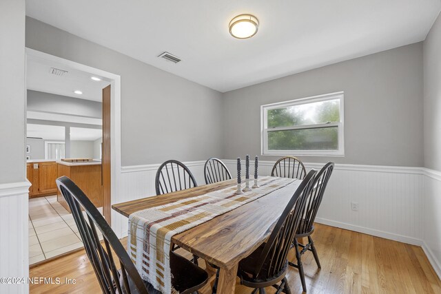 dining space featuring light wood-type flooring