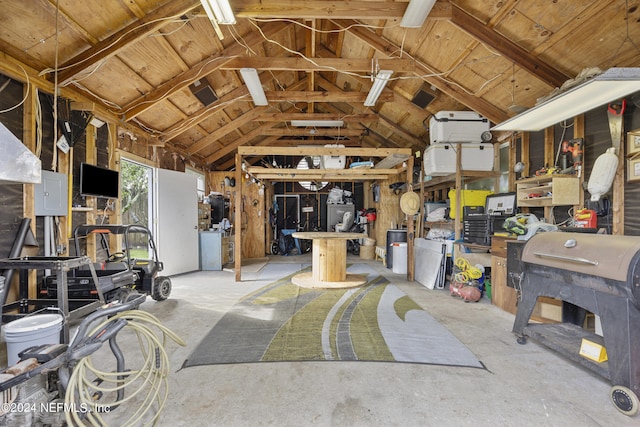 miscellaneous room featuring a workshop area and lofted ceiling