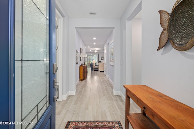 hallway featuring light hardwood / wood-style flooring