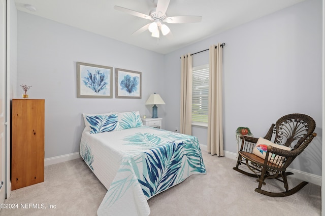 bedroom with light colored carpet and ceiling fan