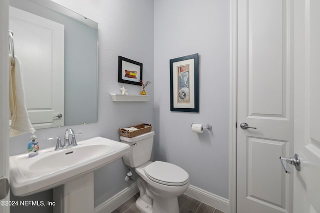 bathroom featuring toilet and hardwood / wood-style floors