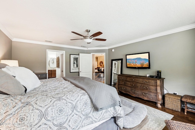 bedroom featuring ceiling fan, ornamental molding, dark wood-type flooring, and ensuite bathroom