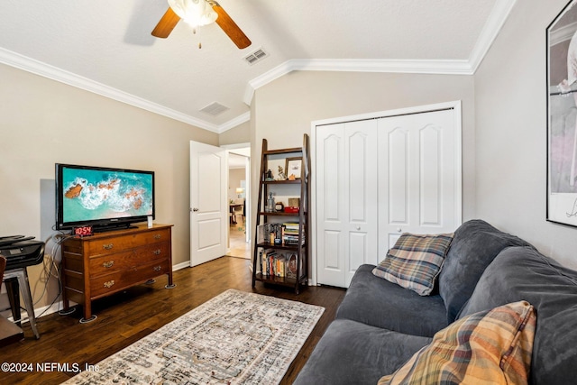 living room featuring lofted ceiling, ceiling fan, dark hardwood / wood-style floors, and crown molding