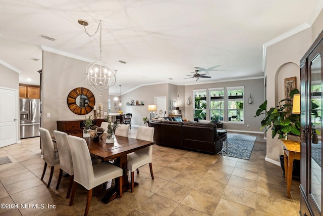 dining area featuring ceiling fan with notable chandelier, vaulted ceiling, and ornamental molding