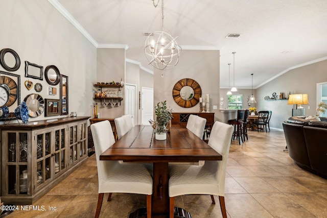 dining room with an inviting chandelier, lofted ceiling, tile patterned floors, and crown molding