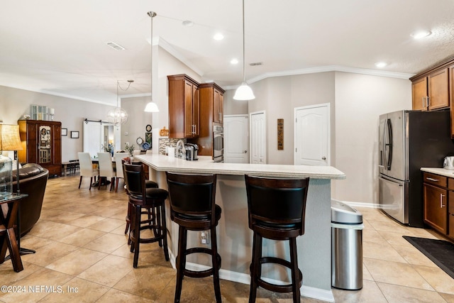 kitchen featuring kitchen peninsula, an inviting chandelier, stainless steel appliances, light tile patterned floors, and crown molding