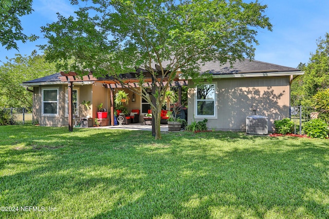 back of property featuring a pergola, a lawn, a patio area, and central air condition unit