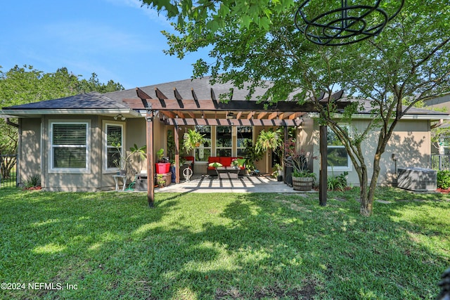 back of house with a pergola, a lawn, a patio area, and central AC