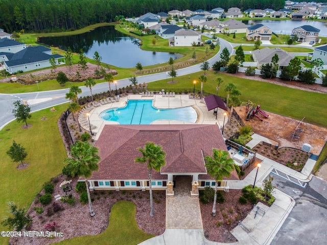 birds eye view of property featuring a water view