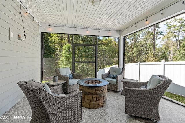 sunroom featuring wood ceiling