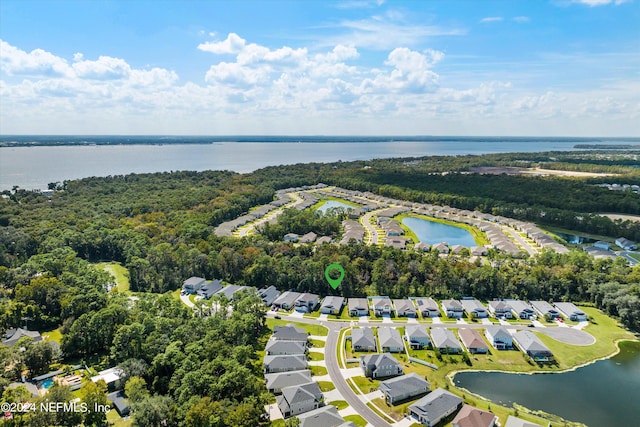 birds eye view of property featuring a water view and a residential view