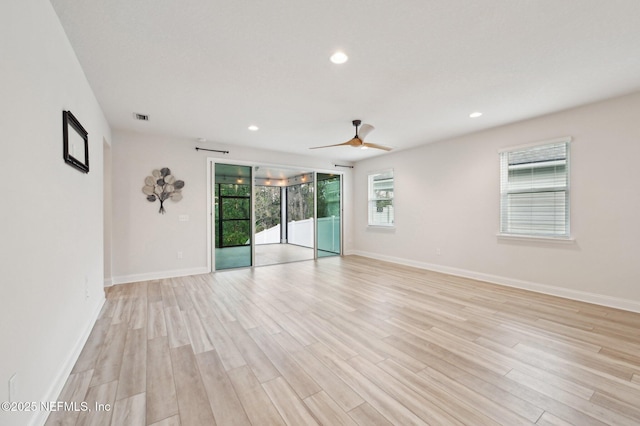 spare room featuring recessed lighting, visible vents, light wood-style flooring, and baseboards