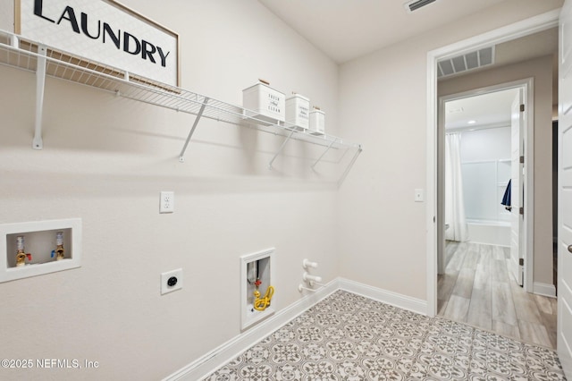 laundry room with hookup for a washing machine, hookup for a gas dryer, laundry area, visible vents, and electric dryer hookup