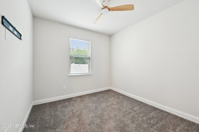 unfurnished room featuring a ceiling fan, carpet flooring, and baseboards