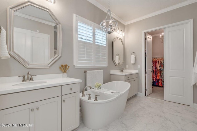 bathroom with an inviting chandelier, vanity, crown molding, and a washtub