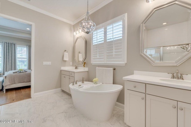 bathroom with a bath, crown molding, vanity, and an inviting chandelier