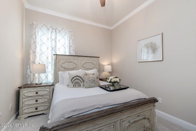 bedroom with ornamental molding, ceiling fan, and light colored carpet