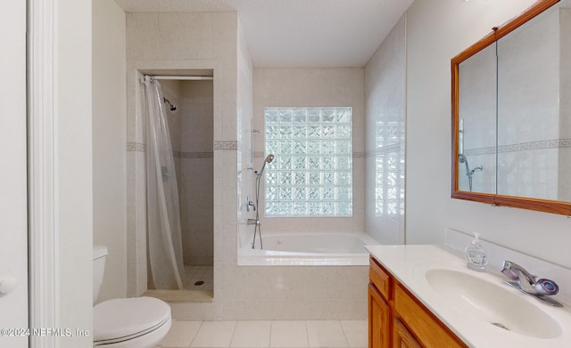 full bathroom with tile patterned floors, vanity, toilet, and plus walk in shower