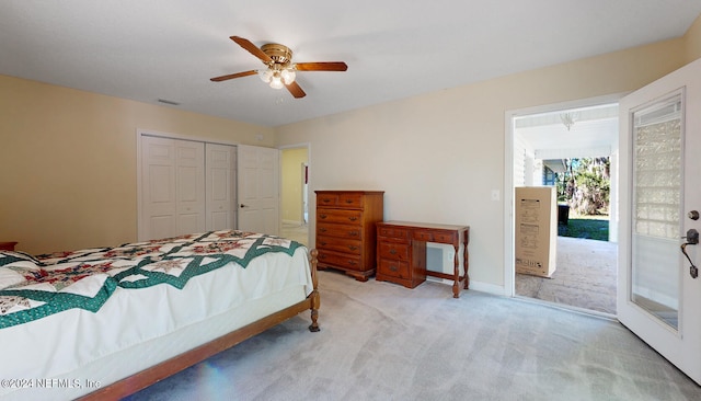 carpeted bedroom featuring a closet, access to outside, and ceiling fan