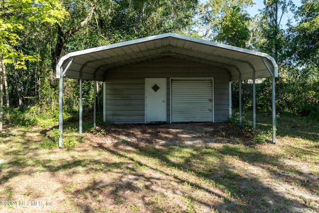 view of outbuilding with a carport