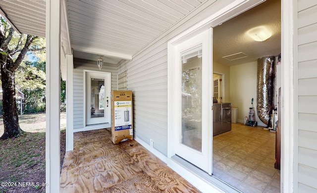 property entrance featuring washer and clothes dryer