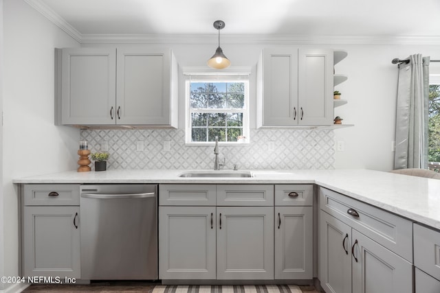 kitchen featuring light wood-type flooring, gray cabinetry, sink, pendant lighting, and dishwasher