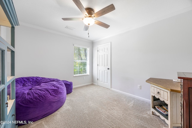 bedroom with ceiling fan, crown molding, and light colored carpet