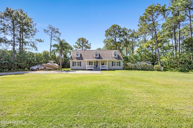 cape cod house with a front lawn and a porch