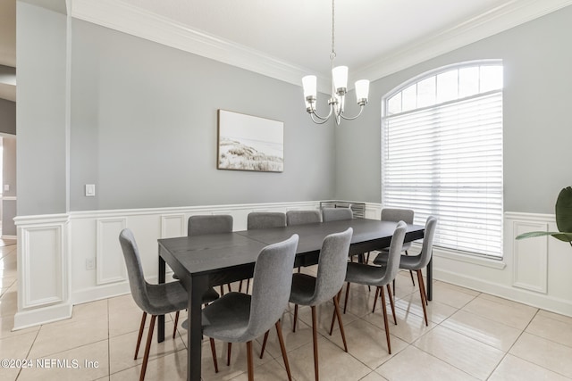 tiled dining space with a notable chandelier and crown molding