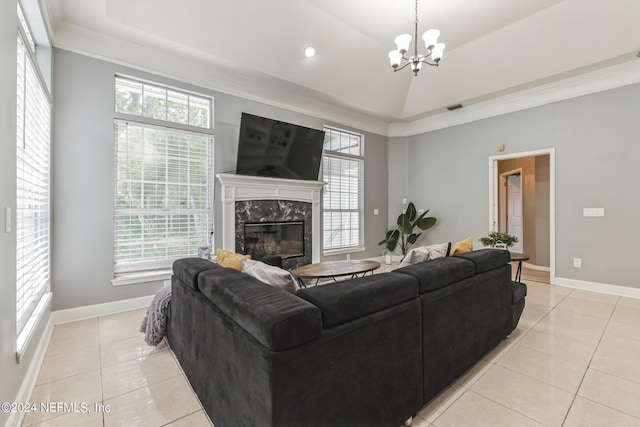 tiled living room with ornamental molding, plenty of natural light, and a fireplace