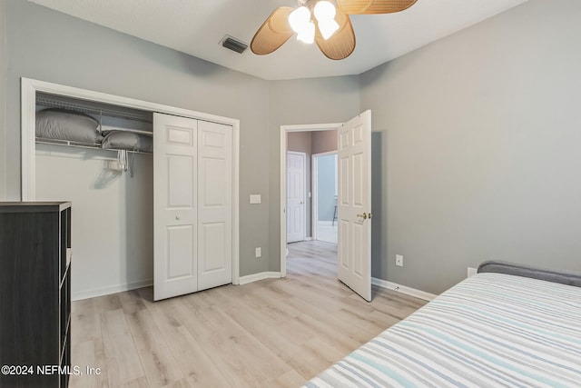 bedroom featuring a closet, light wood-type flooring, and ceiling fan