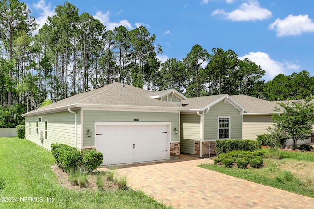 view of front facade with a garage and a front yard