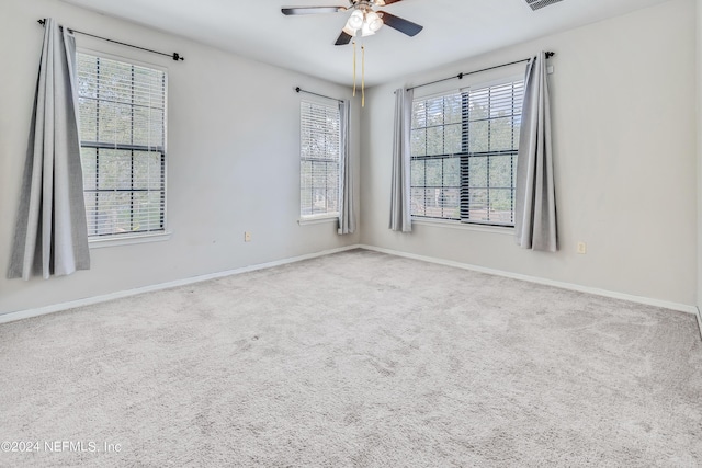 12700 Bartram Park Blvd Unit 124, Jacksonville, FL 32258 - spare room with baseboards, carpet, a healthy amount of sunlight, and a ceiling fan
