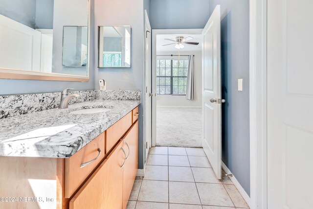 bathroom featuring vanity, tile patterned floors, and ceiling fan